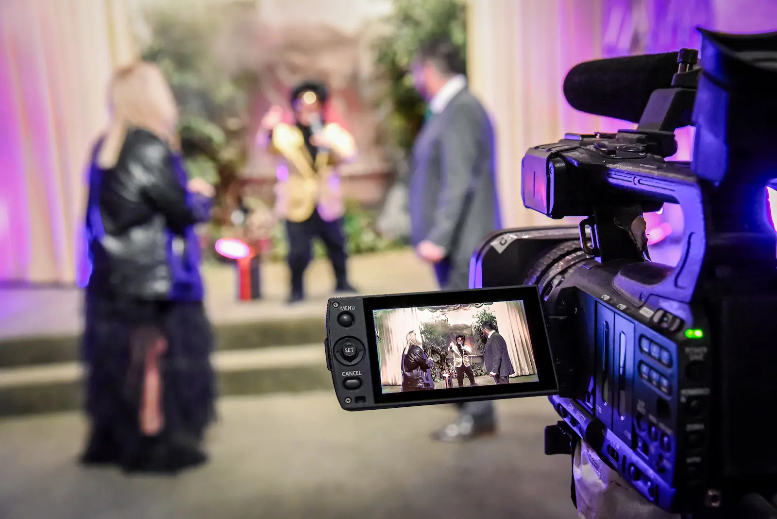 Professional videographer filming wedding ceremony at Viva Las Vegas Wedding Chapel
