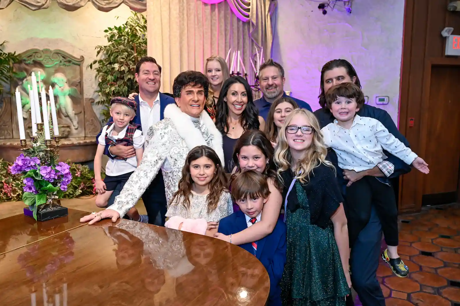 wedding family group photo Liberace impersonator sequin jacket grand piano Las Vegas chapel