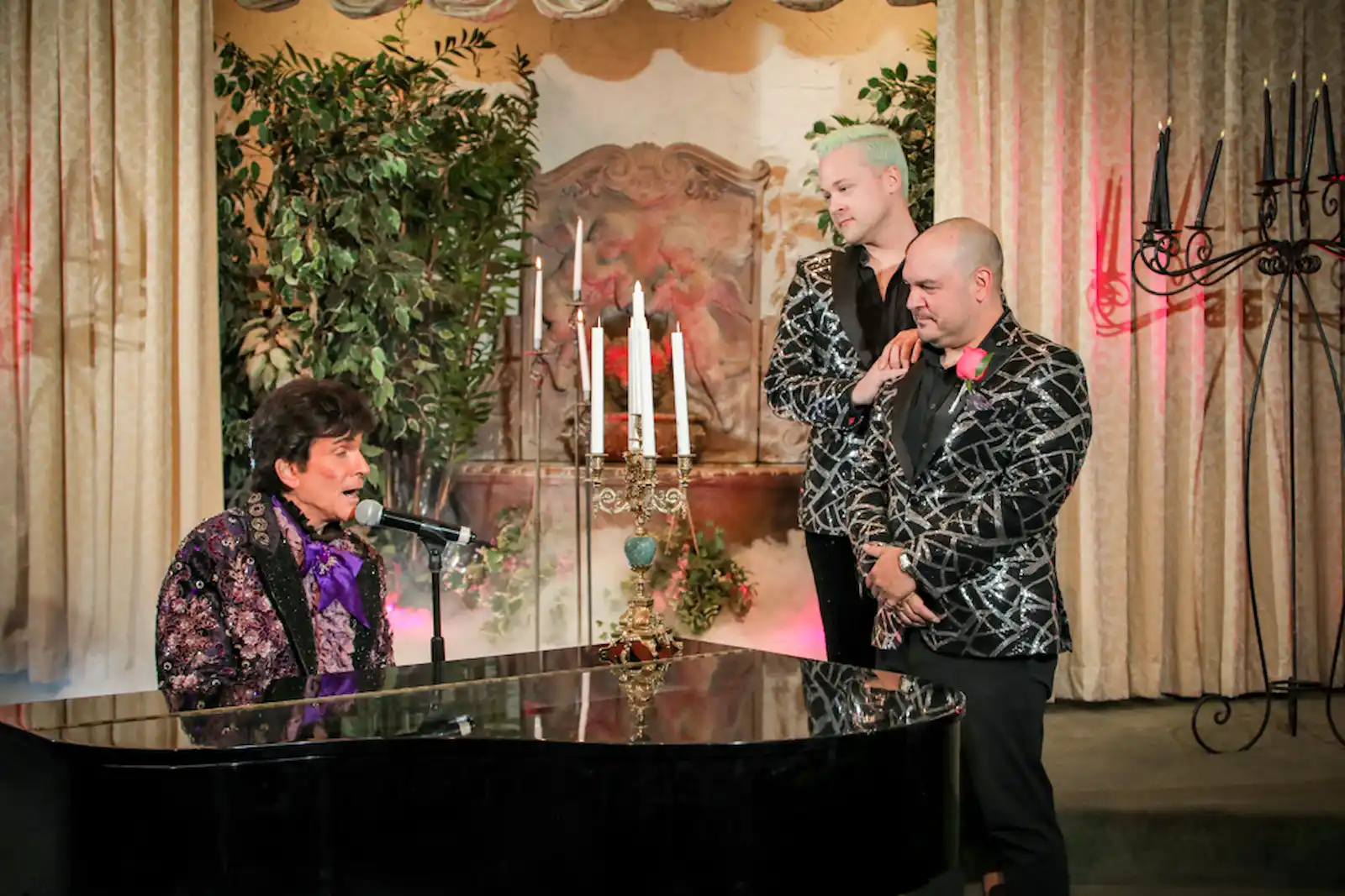 Liberace impersonator serenading same sex couple piano candelabra Las Vegas wedding