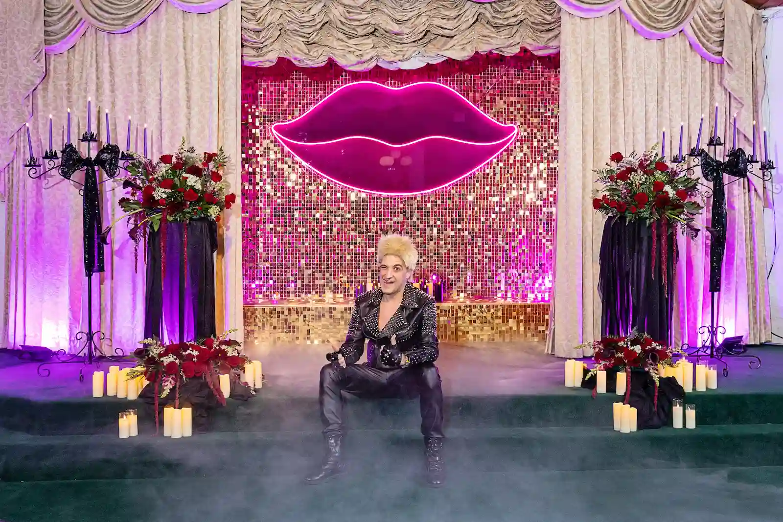 Billy Idol impersonator singing on stage while couple celebrates at Viva Las Vegas Wedding Chapel