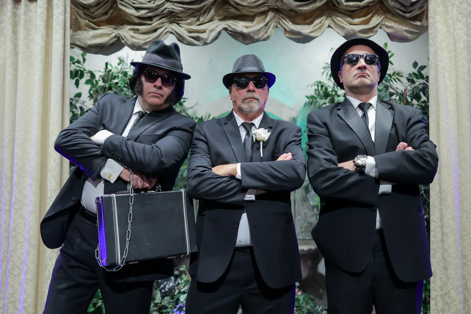groom posing Blues Brothers impersonators black suits sunglasses fedora hats Las Vegas