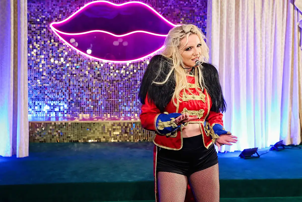Professional Britney Spears impersonator posing for a themed wedding experience