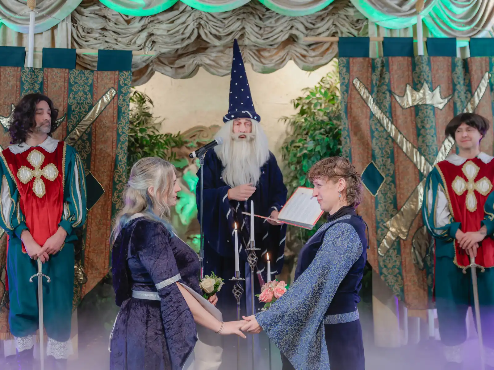 A couple holding hands during an intimate fantasy-themed wedding ceremony in a Las Vegas chapel with a wizard officiant.