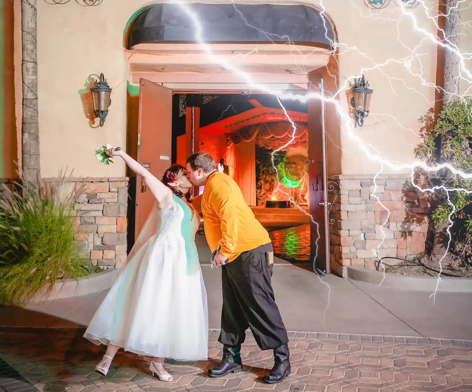 Star Trek-themed bride and groom sharing their first kiss outside a Las Vegas wedding chapel with dramatic lightning effects.