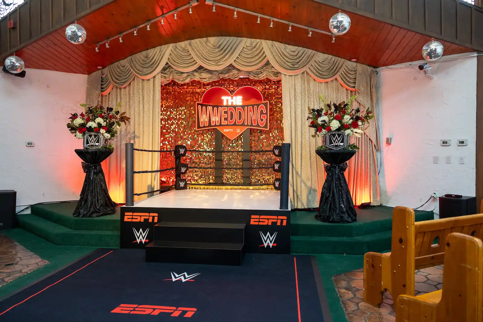 WWE wrestling ring setup with ESPN branding and The WWedding sign at a Las Vegas wedding chapel