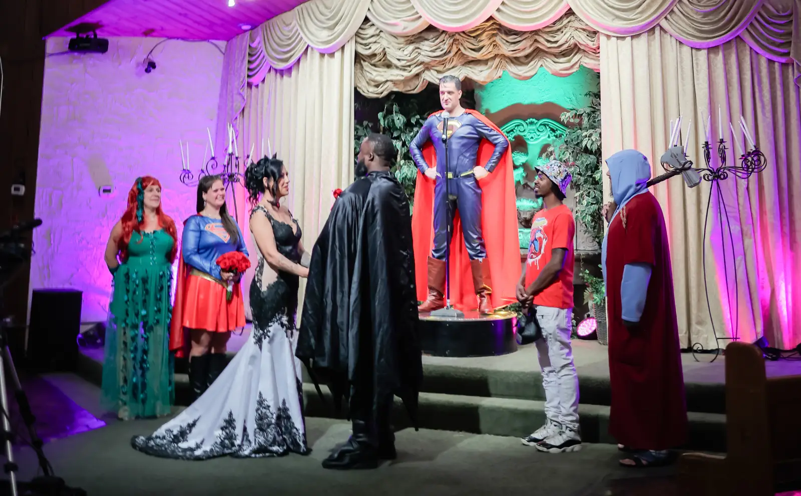 superhero themed wedding ceremony group with batman superman and guests at las vegas chapel