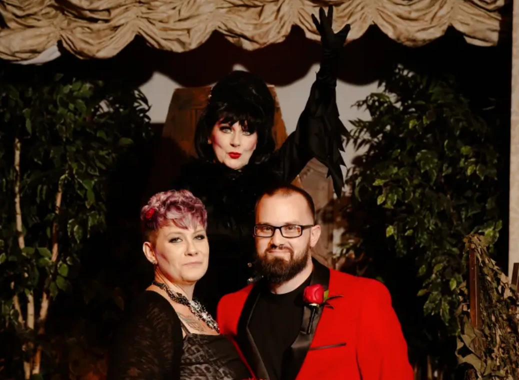 gothic-wedding-couple-elvira-officiant-red-lighting
