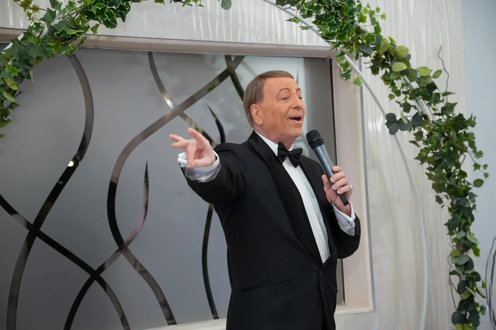 Frank Sinatra impersonator tuxedo bow tie singing microphone Las Vegas wedding chapel