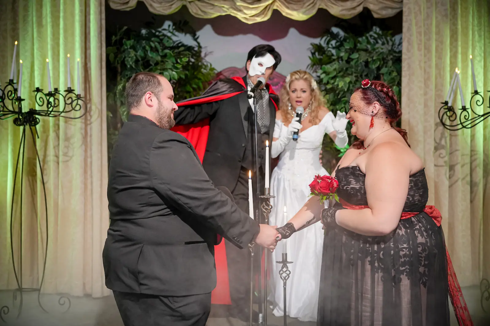 couple exchanging vows Phantom of the Opera impersonators officiant gothic wedding Las Vegas