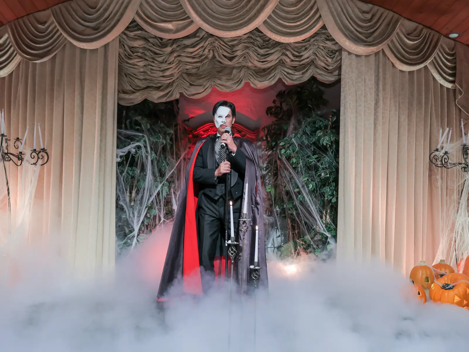 phantom of the opera impersonator performing at halloween themed wedding ceremony