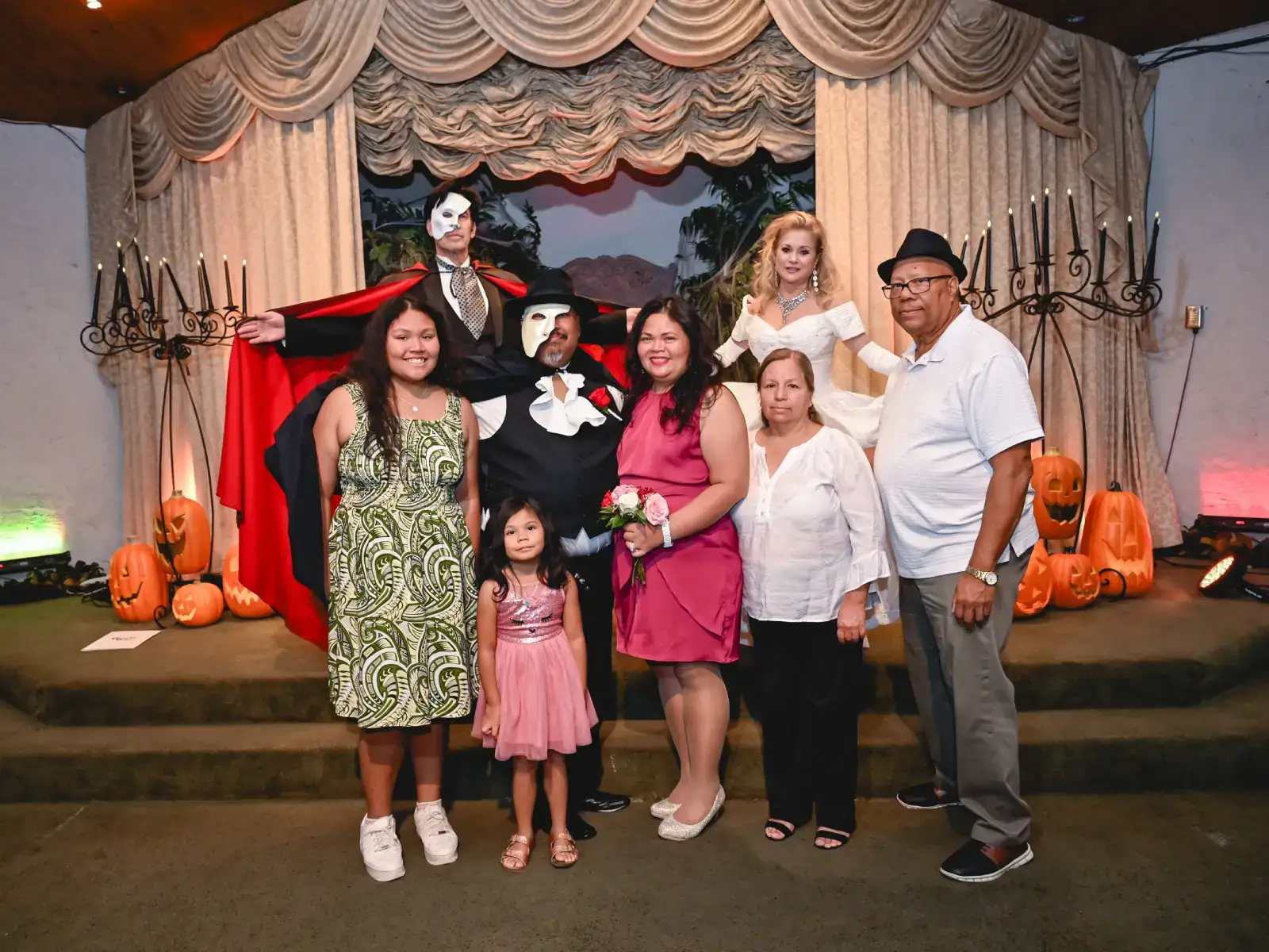 family group photo with phantom impersonator at halloween themed wedding las vegas