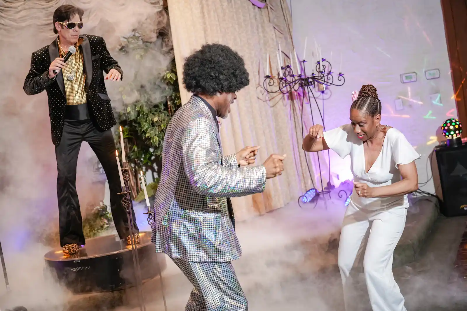 newlyweds dancing disco wedding Elvis impersonator fog effects Las Vegas chapel