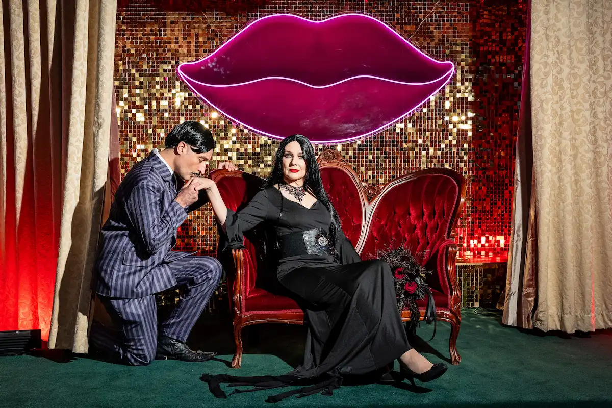 Gomez Addams character impersonator kissing Morticia