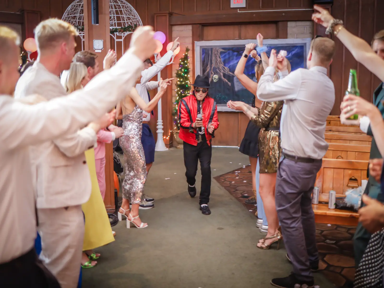 Michael Jackson impersonator in red Thriller jacket walks down the aisle as wedding guests cheer at Las Vegas chapel