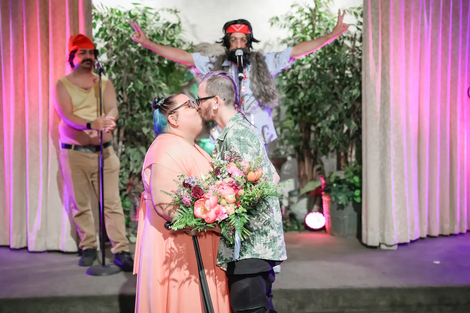 Newlyweds share their first kiss as Cheech and Chong impersonators celebrate at Las Vegas wedding chapel