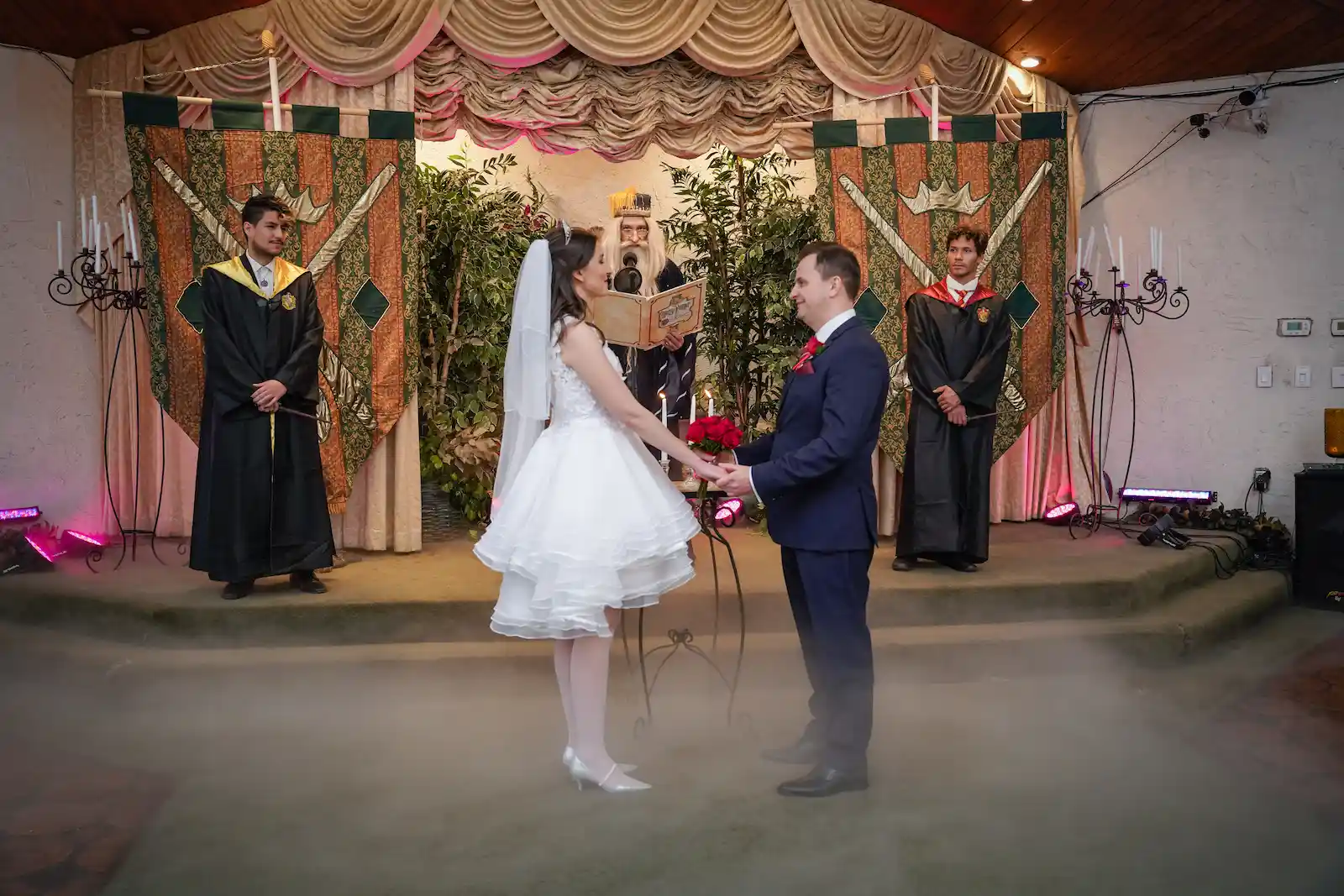 bride groom holding hands wizard officiant Hogwarts themed wedding Las Vegas