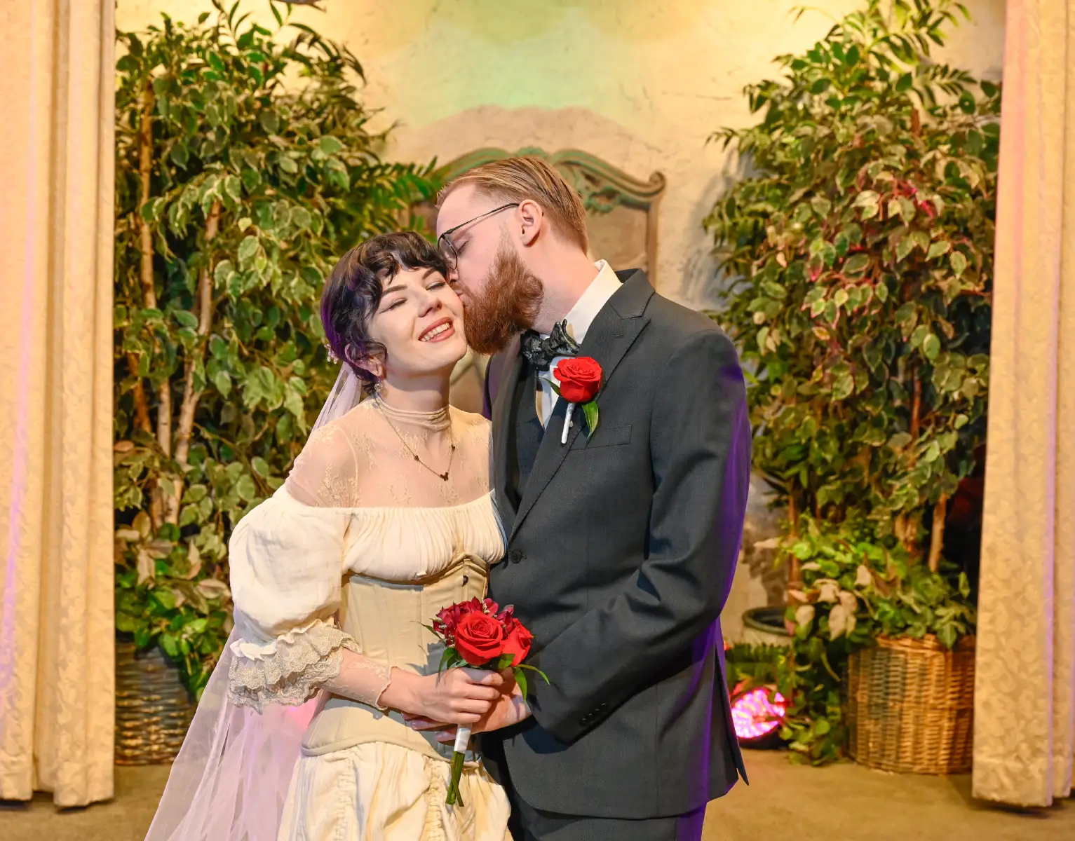 Couple embracing during romantic vintage-style Las Vegas wedding ceremony