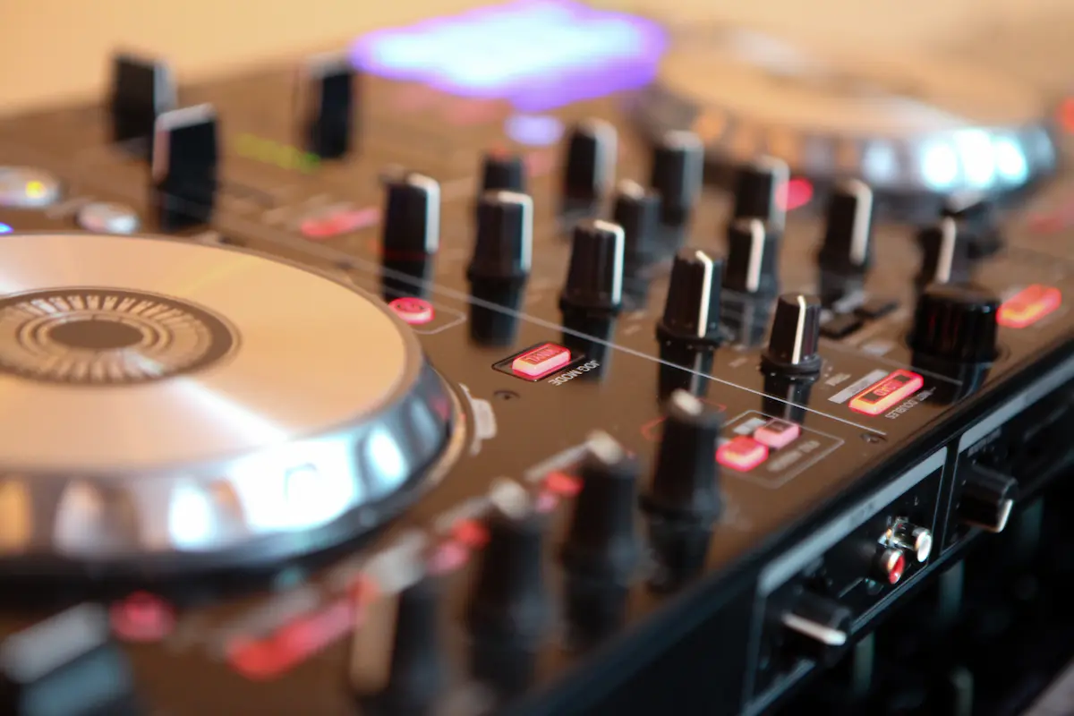  DJ controller with faders and purple lights set up for a Vegas wedding reception