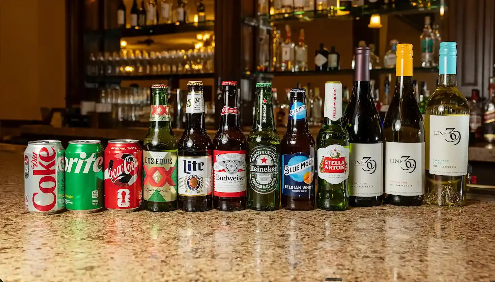 Beer, wine, and soda selection including Heineken, Blue Moon, Stella Artois, and Line 39 wines displayed on a wedding reception bar in Las Vegas