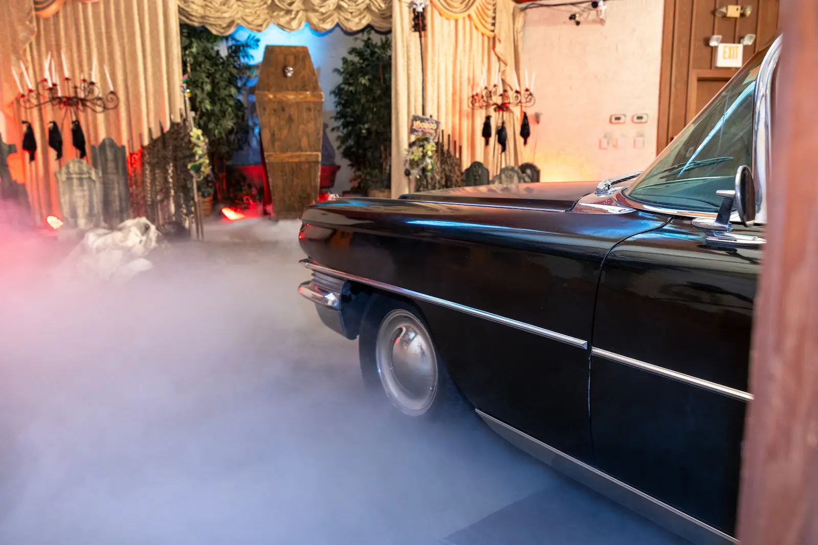 Gothic Halloween themed wedding chapel setup with black vintage Cadillac and dry ice fog at Viva Las Vegas Weddings